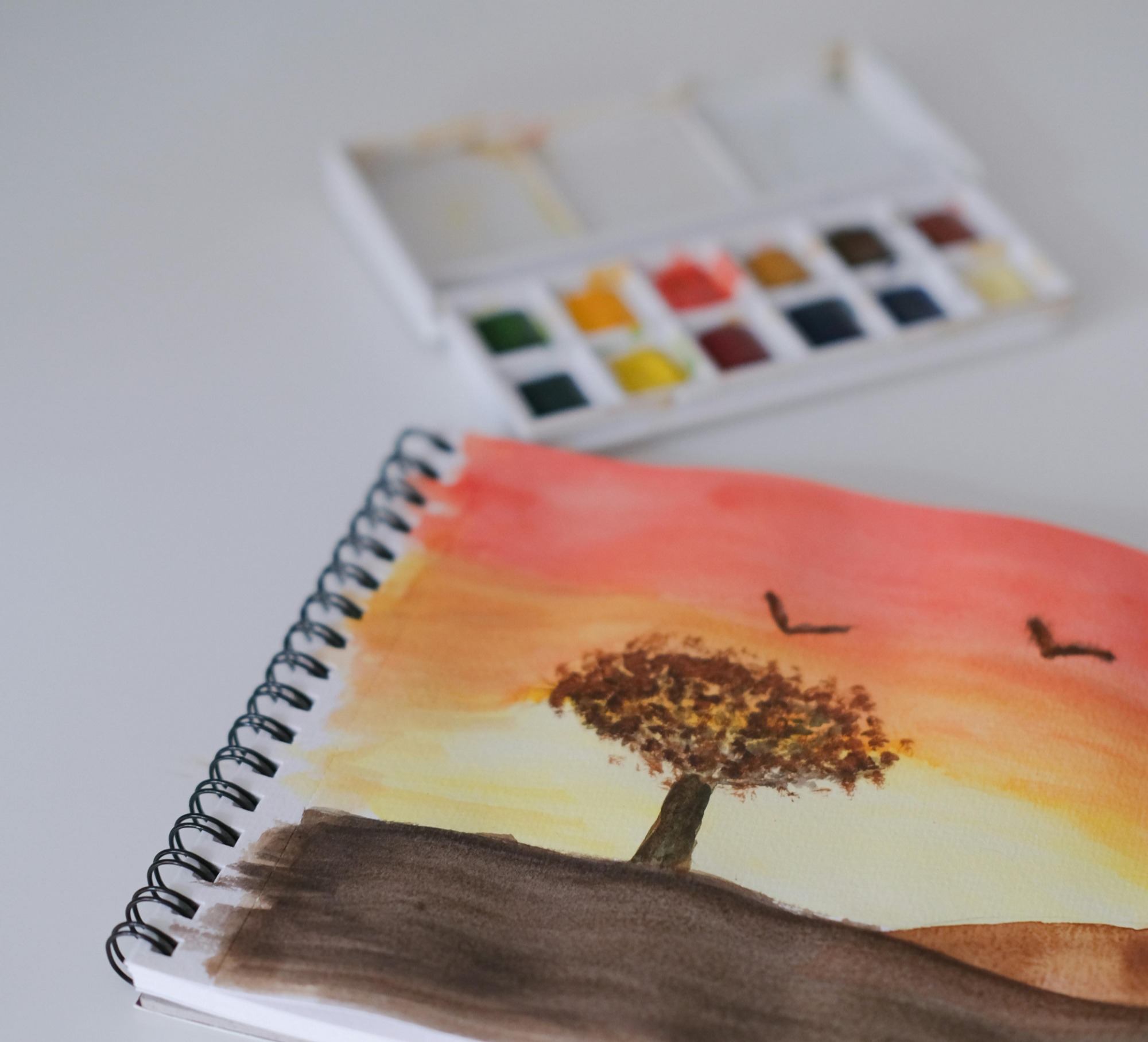 drawing of a tree at sunset