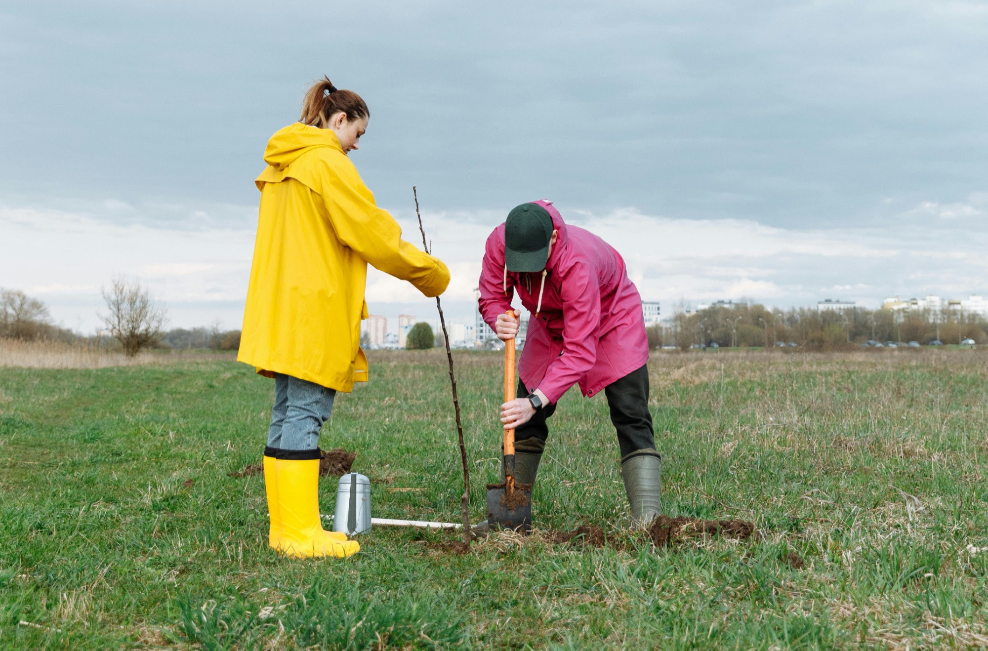 boy and girl digging with shovels