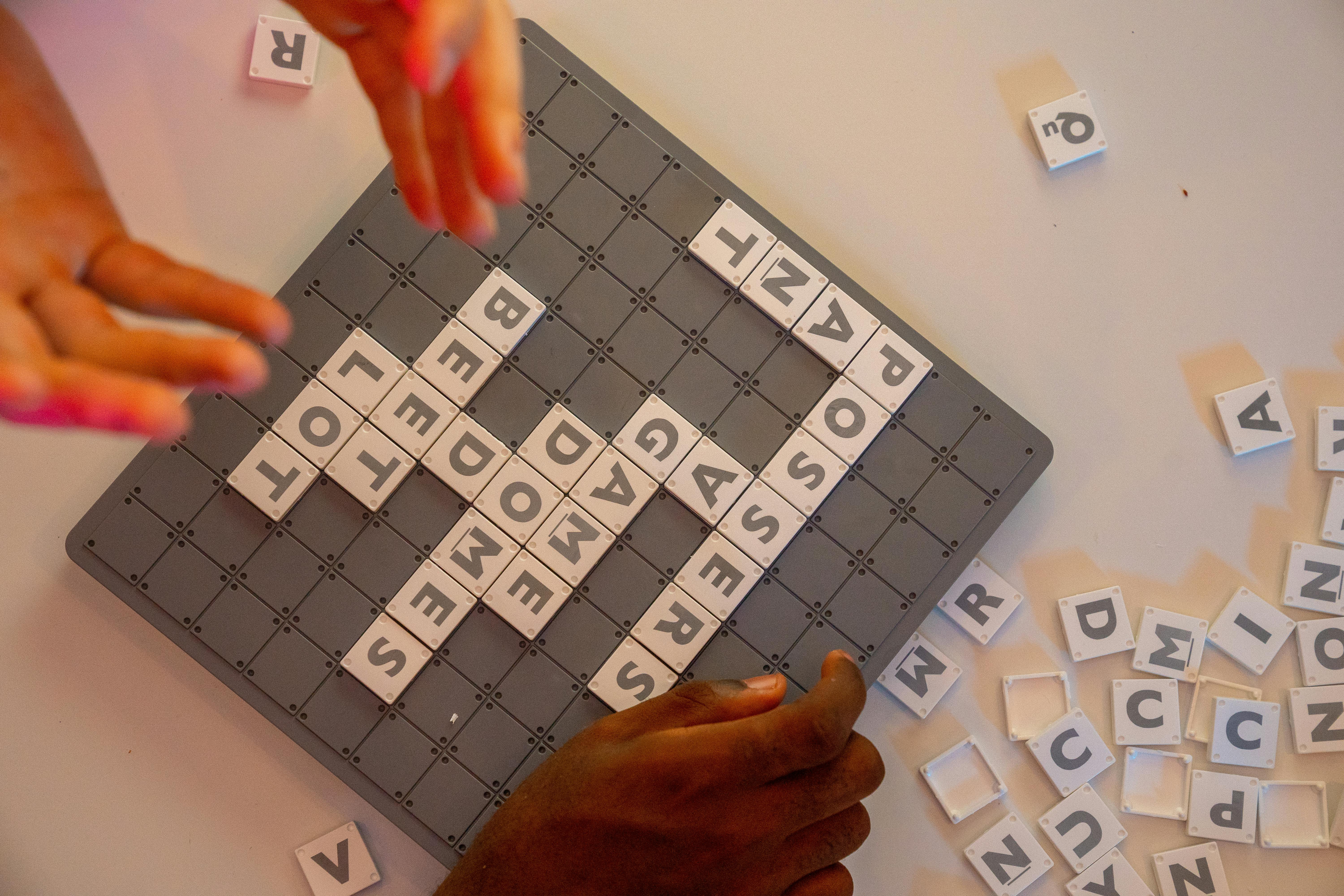 adults playing scrabble