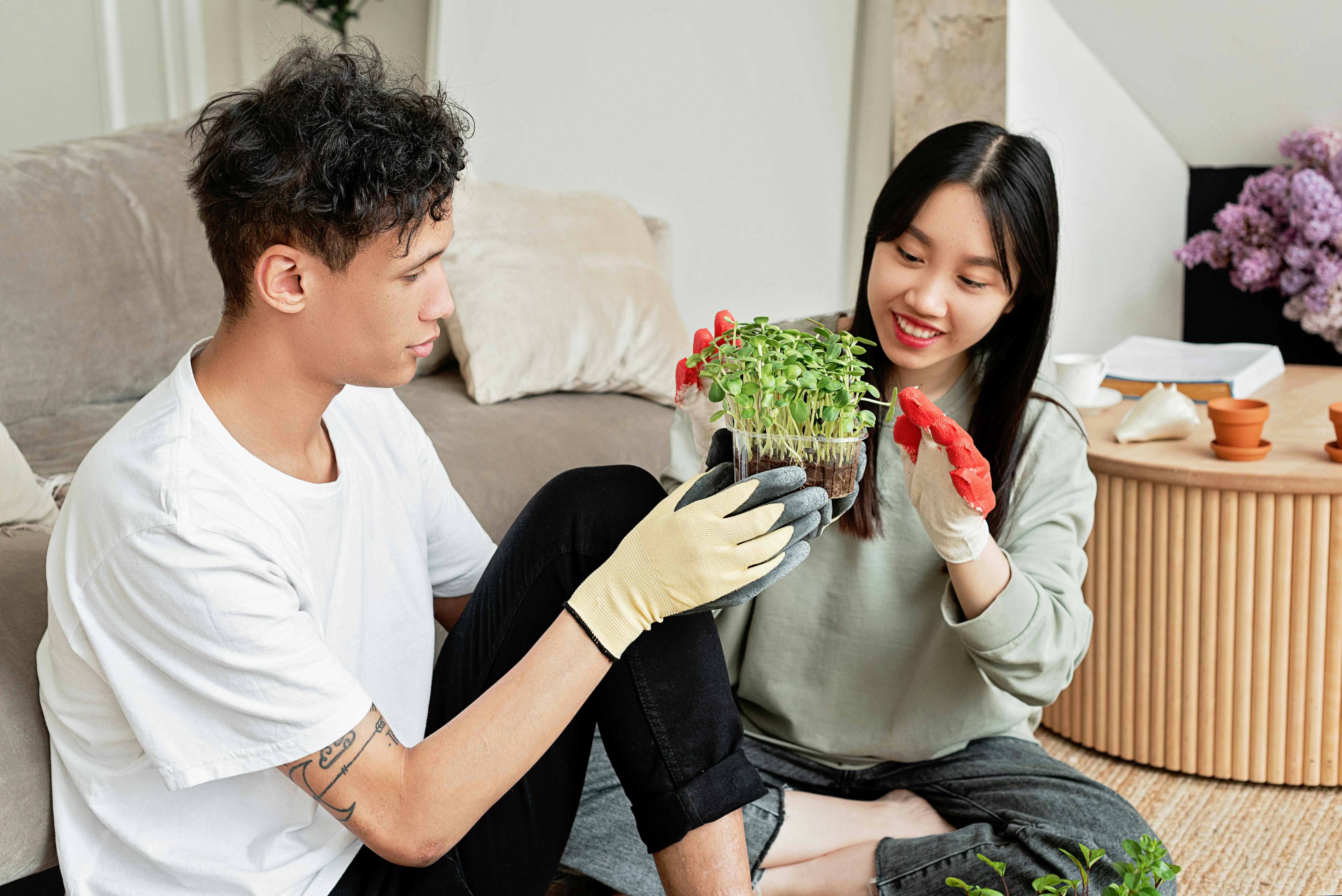 man and woman planting flowers