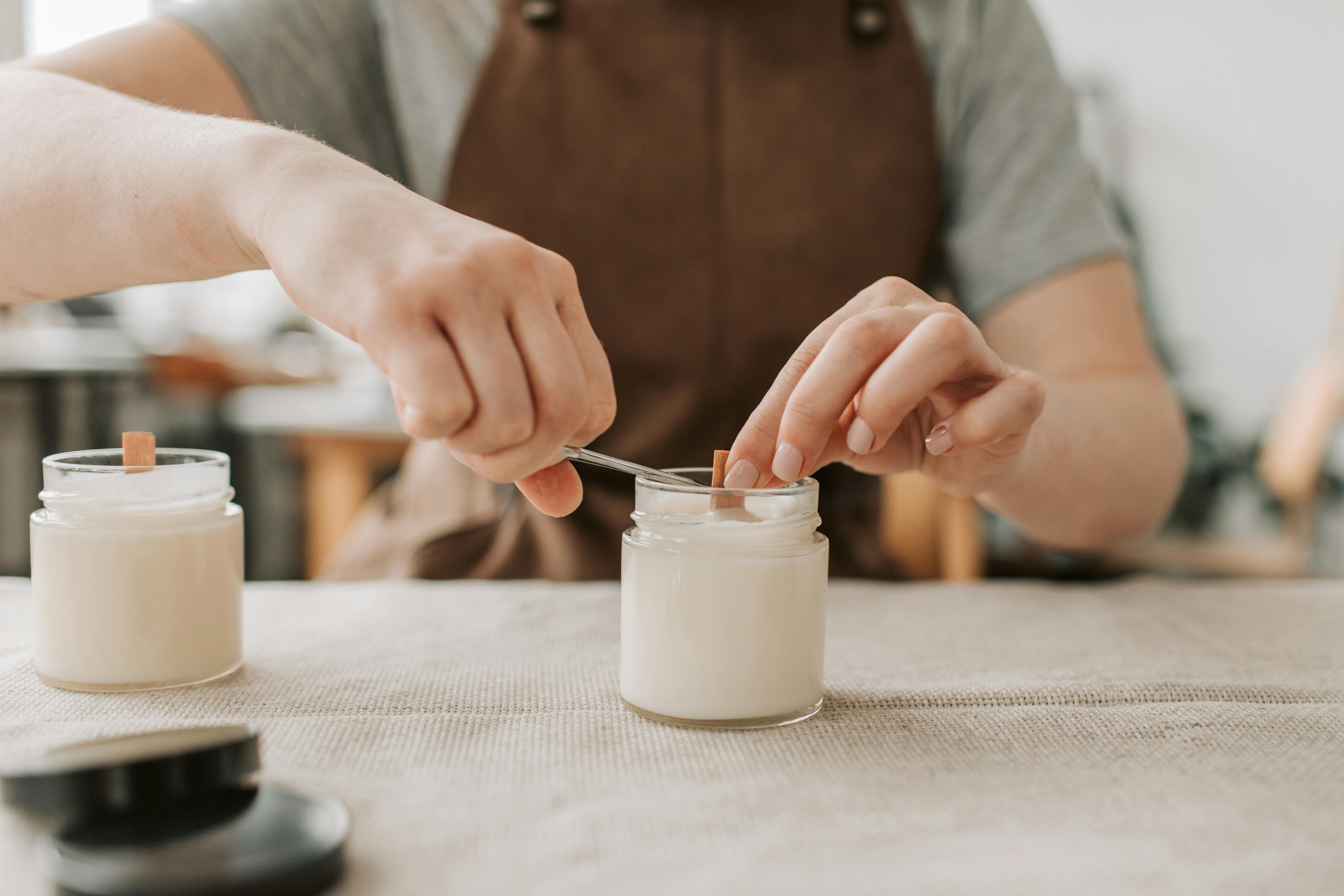 woman holding wick to make candles