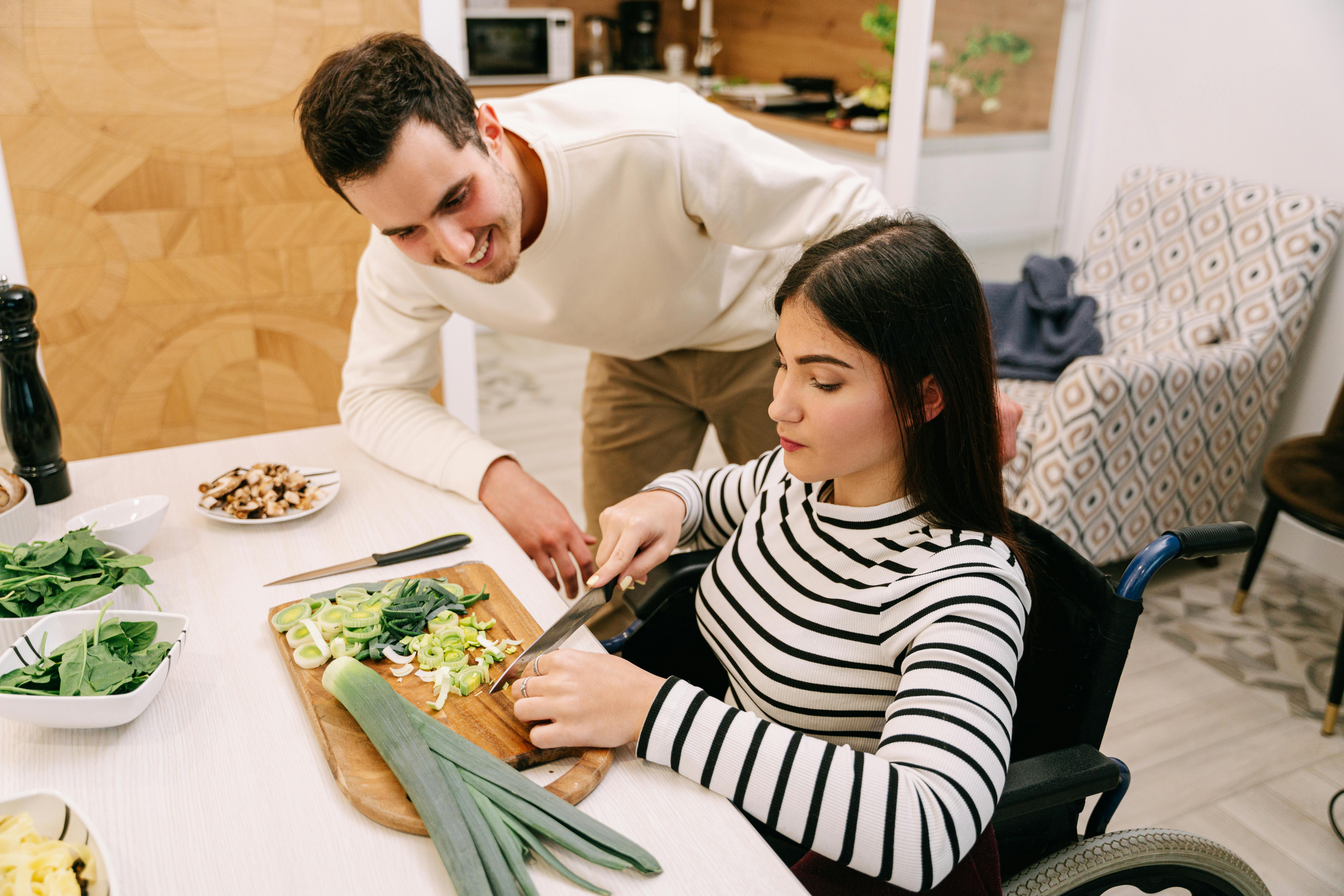 man and woman cooking in kitchen