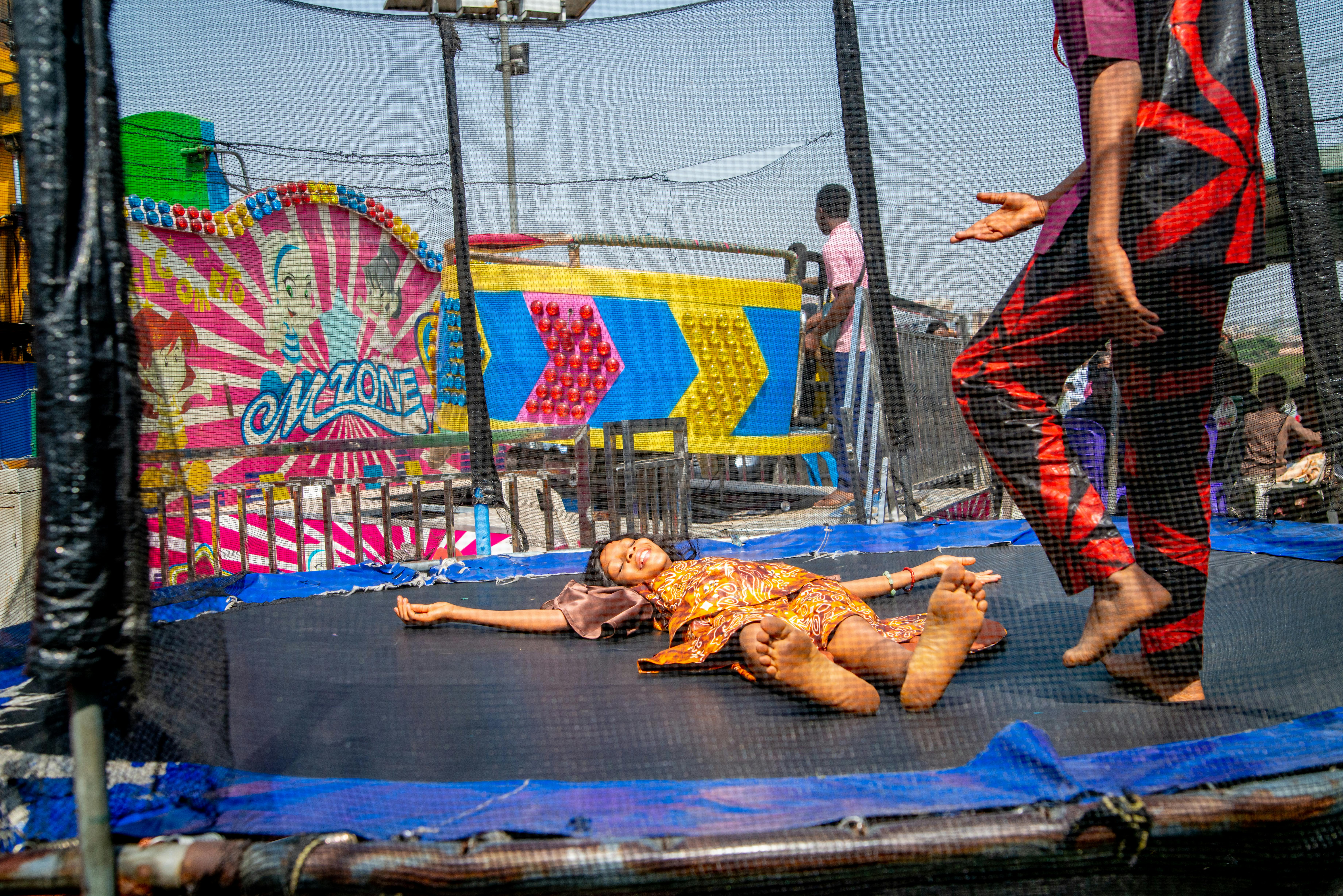 man and woman on trampoline