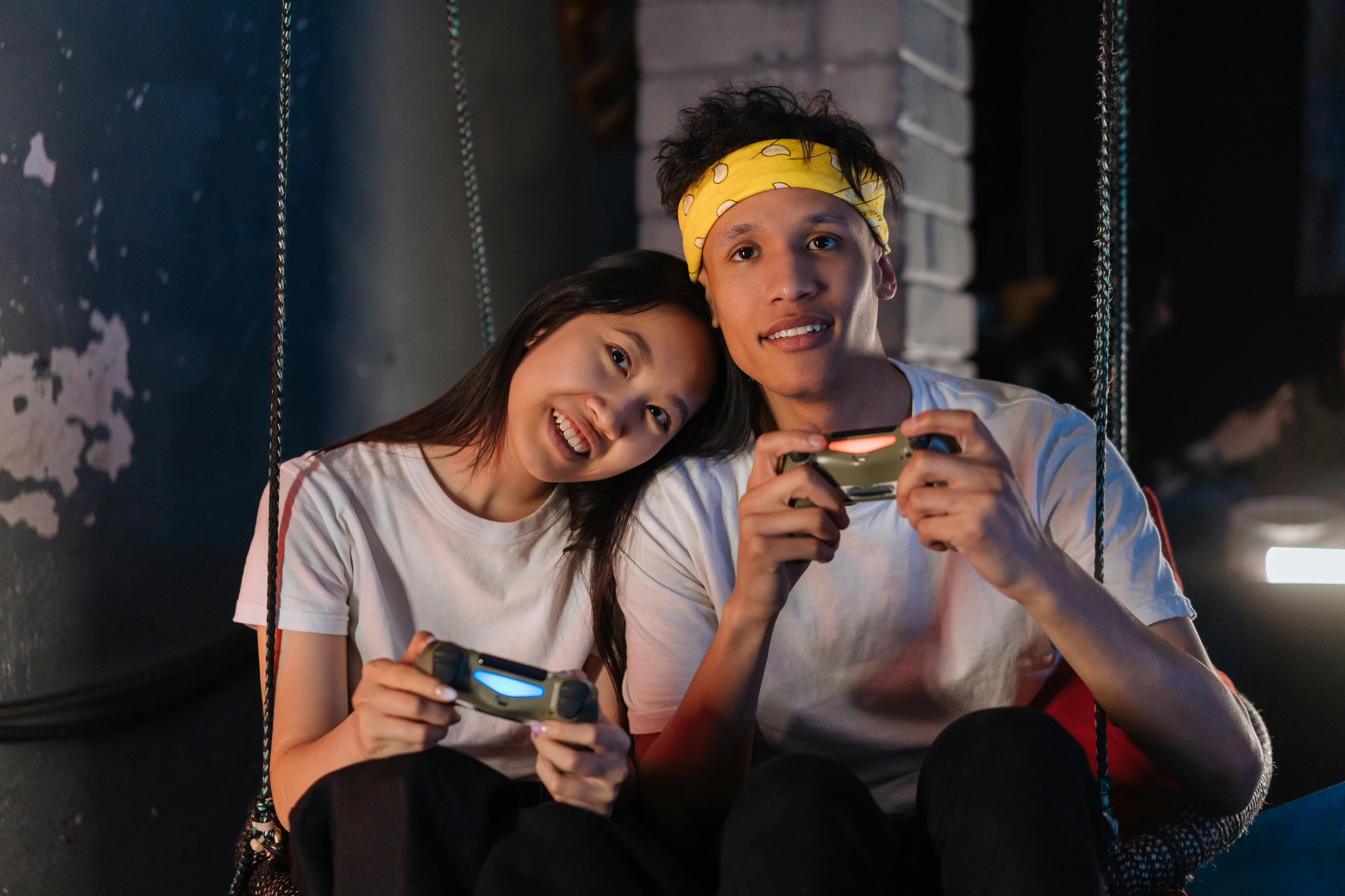 boy and girl couple playing video game