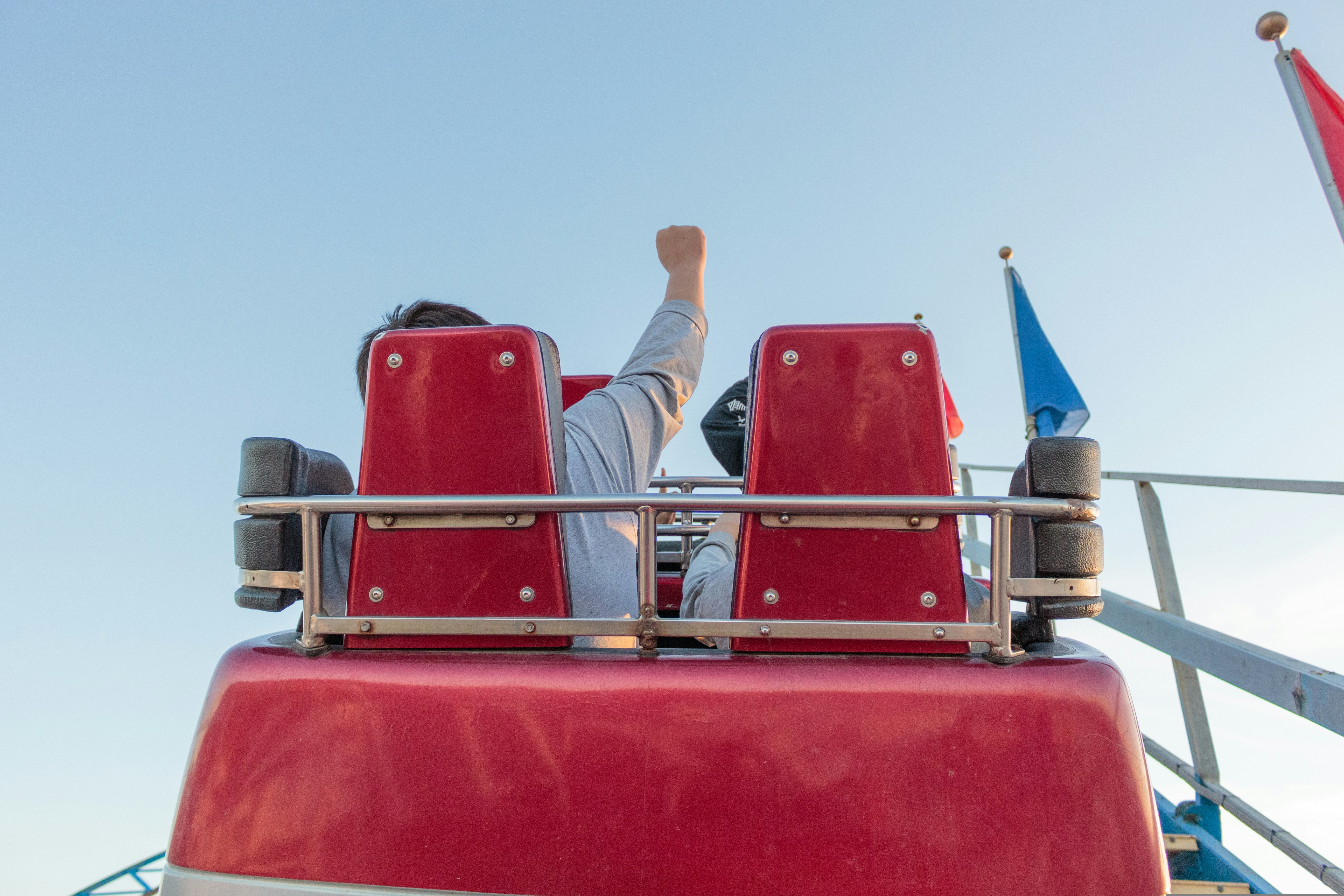 two people on rollercoaster