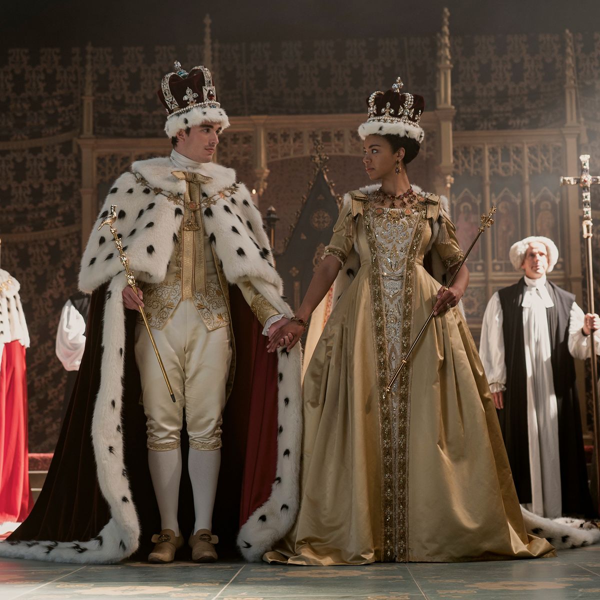 King George and Queen Charlotte holding hands on coronation day